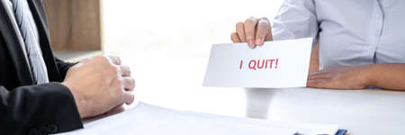 Image of business woman hand sending a resignation letter to executive boss, Change of job, unemployment, resign concept.の写真素材