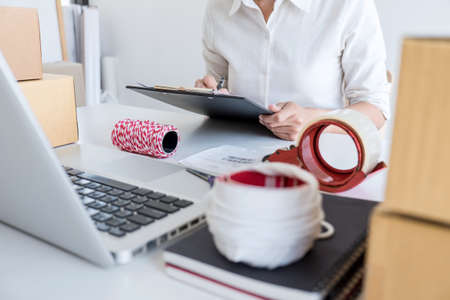 Shipment Online Sales, Small business or SME entrepreneur owner delivery service and working packing...