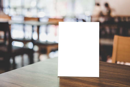 Mock up acrylic frame posters pattern template forms background, blank menu frame on table in coffee shop or restaurant stand for your text of display your product.の写真素材
