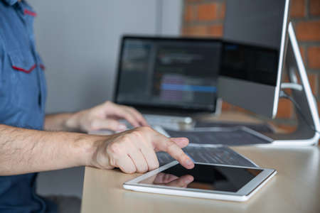 Young Professional programmer working at developing programming and website working in a software...