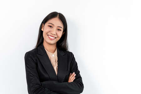 Portrait of Smiling asian happy business woman with crossed arms and looking at the camera.の写真素材