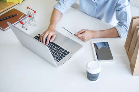 Woman using credit card register security code payments online shopping and customer service network connection market, using technology on laptop, Internet Online shopping or banking concept.の写真素材