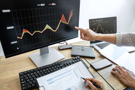 Business team investment working with computer, planning and analyzing graph stock market trading with stock chart data, business financial investment planning concept.の写真素材