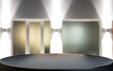 Empty wooden table and blurred background of abstract in front of coffee shop or restaurant for display of product or for montage.の写真素材