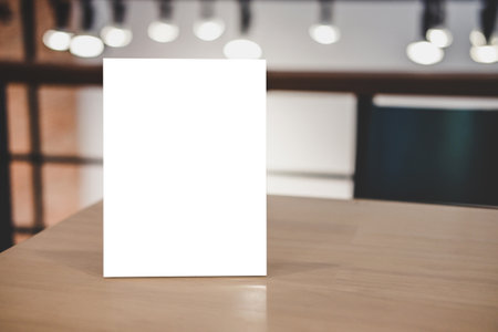 Mock up acrylic frame posters pattern template forms background, blank menu frame on table in coffee shop or restaurant stand for your text of display your product.の写真素材