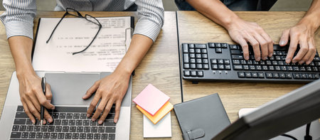 Writing codes and typing data code technology, Programmer team working on web site project in a...