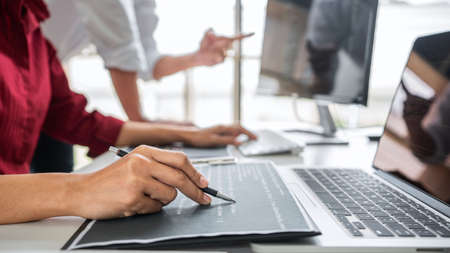 Programmers cooperating at Developing programming and website working in a software develop company...