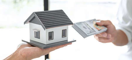 Home for rent, Broker agent presenting and consult detail to customer to making the decision a home estate loan to customer sign  agreement and sending home model after approve and receive money.の写真素材