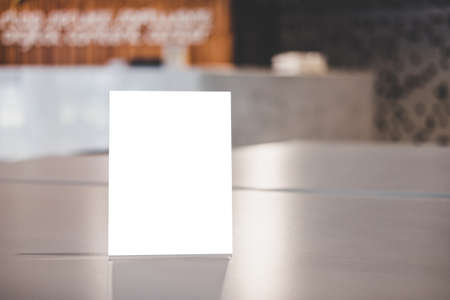 Mock up acrylic frame posters pattern template forms background, blank menu frame on table in coffee shop or restaurant stand for your text of display your product.の写真素材