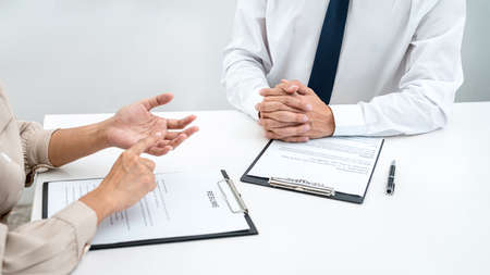 Woman employer is asking with candidate question and explaining about job description to applicant...