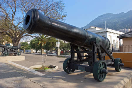 Row of original, cast iron and historical cannons in Gibraltar on a sunny dayの写真素材