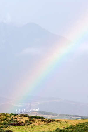 Colourful rainbows end in a field after a big storm in Spainの写真素材