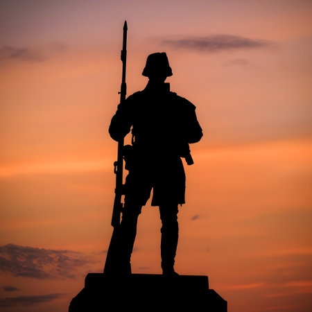 Silhouette of a soldier with a rifle at sunset background.の素材