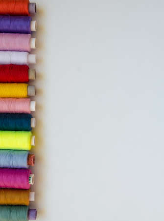 Few bobbins isolated on white background verticalの写真素材