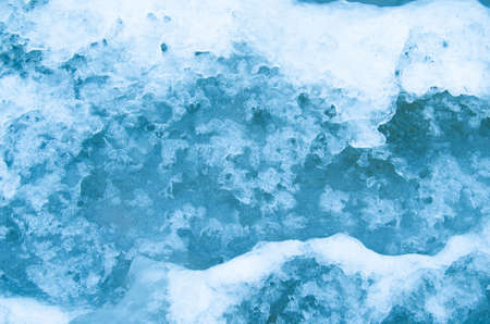 Beginning of winter freezing waterの写真素材