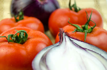 Background from onions and tomatoesの写真素材