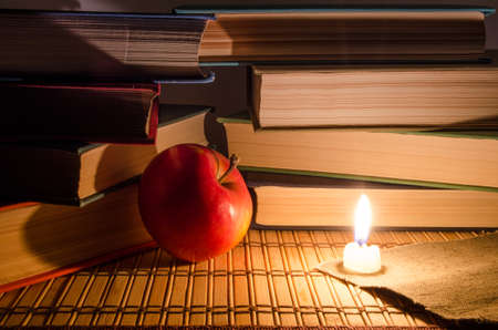 Many books by candlelightの写真素材