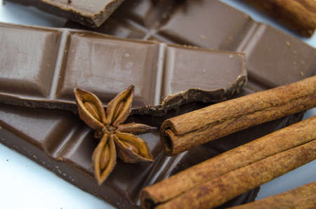 Milk chocolate, cinnamon sticks and star aniseの写真素材