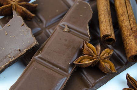 Milk chocolate, cinnamon sticks and star aniseの写真素材