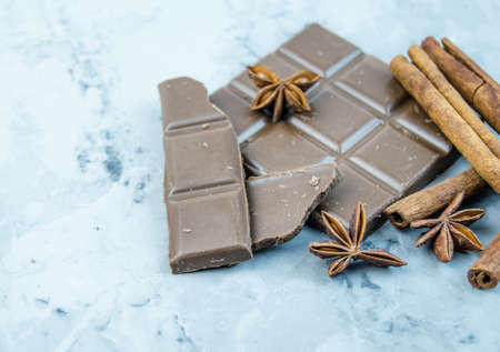 Milk chocolate, cinnamon sticks and star aniseの写真素材