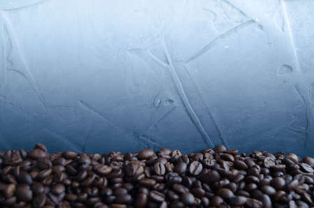 Coffee grains on a blue backgroundの写真素材