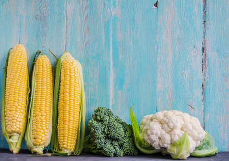 Three maize and two cabbageの写真素材