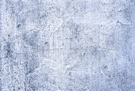 The texture of the concrete wall.