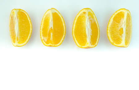 Slices of orange on a white background.の写真素材