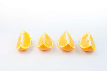 Slices of orange on a white background.の写真素材