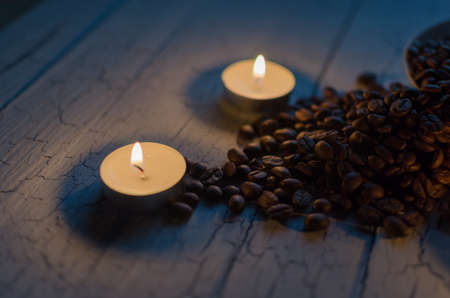 Coffee beans on the old table.の写真素材