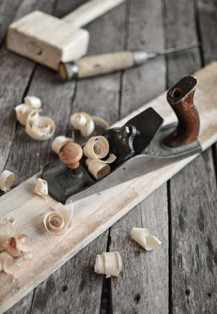 Carpentry tools on an old board tableの写真素材