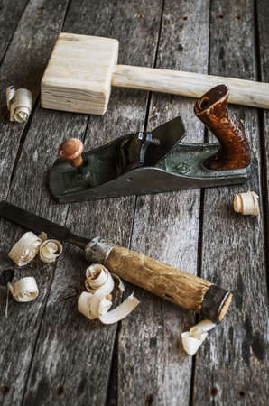 Carpentry tools on an old board tableの写真素材