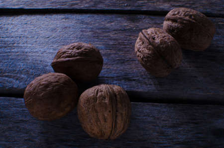 Walnuts on the old tableの写真素材