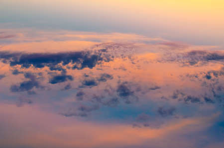 Pink sunset reflected in a summer pond