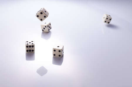 Playing white dice on a light background closeupの写真素材