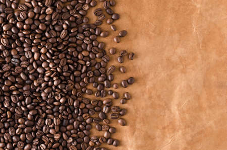 Coffee beans on sostarennoy brown paper closeupの写真素材