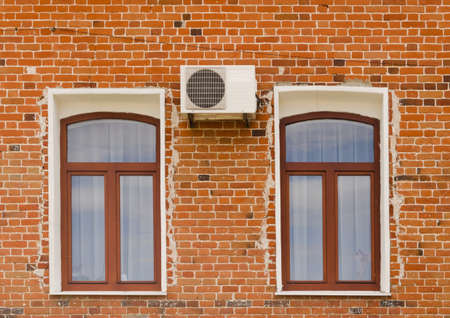 Old brick building with Windows and air conditioning