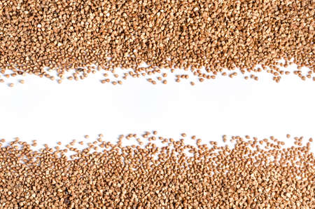 Scattering of buckwheat on a white background closeupの写真素材