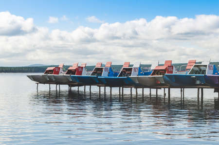 Catamarans on the pier, summer swimming season on the lake.の写真素材