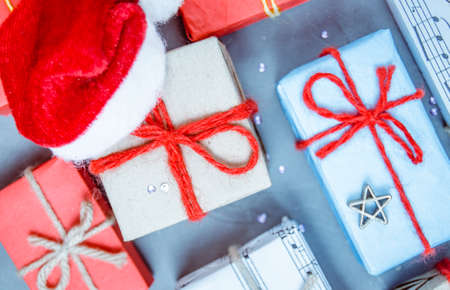 Christmas gifts and Santa's red hat.New year, children and adult winter holiday.の写真素材