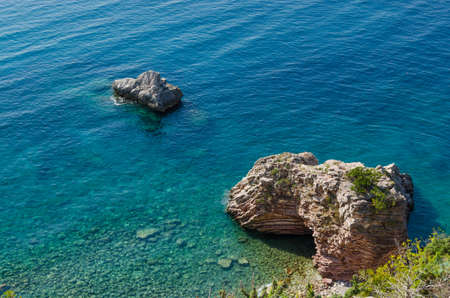 Clear blue water with rocks in the Adriatic seaの写真素材