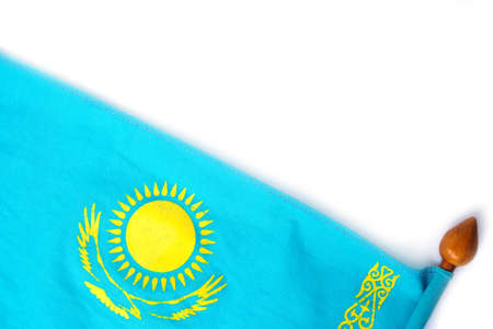 Flag of Kazakhstan on a wooden flagpole with a white background.の写真素材