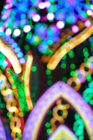 Abstract Christmas background, bokeh of colorful garlands.の写真素材
