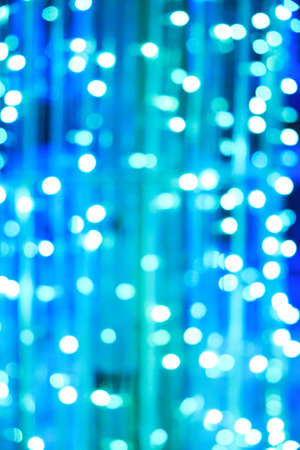 Abstract background of bright blue glowing Christmas garlandsの写真素材