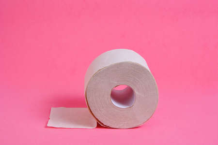 Roll of toilet paper on a pink backgroundの写真素材