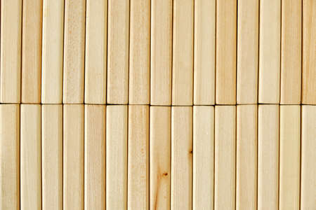 Background of wooden tightly folded rectangular bricks