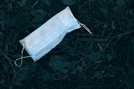 Discarded used medical mask. Exacerbations of the epidemic situation, virusesの写真素材