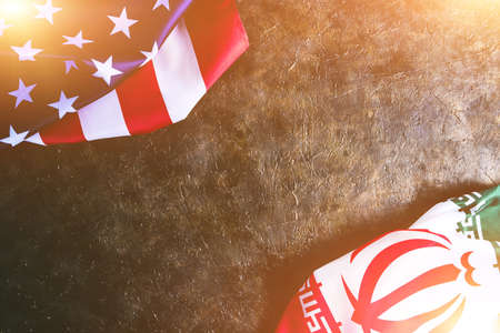 Flags of Iran and the United States of America in the sunの写真素材