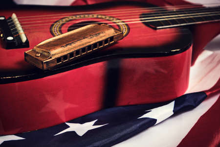Star spangled banner, guitar and harmonica. Musical instrument and flag of the United States of Americaの写真素材
