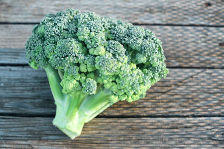 Broccoli on an old village background in the light of day